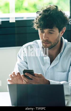 Businessman using smartphone Stock Photo