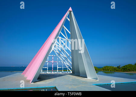 A modern pink sculpture, loosely modeled as a church, at the beach on Cijin Island in Kaohsiung, Taiwan. Stock Photo