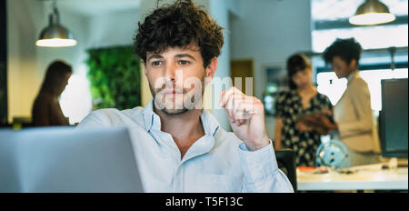 Businessman using laptop Stock Photo