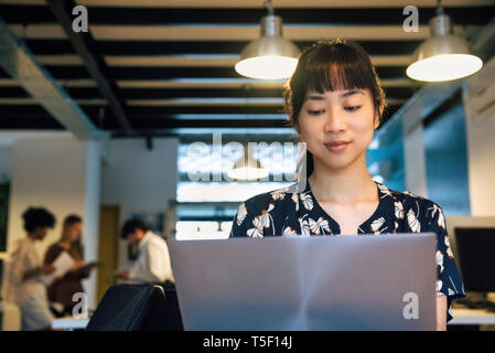 Businesswoman using laptop Stock Photo