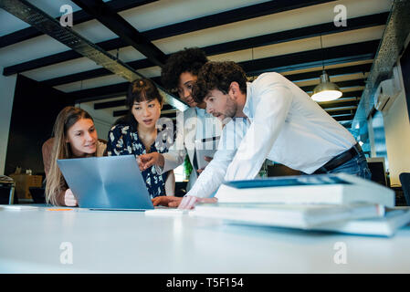 Business people using laptop in office Stock Photo