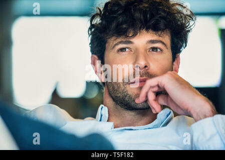 Businessman sitting in office Stock Photo