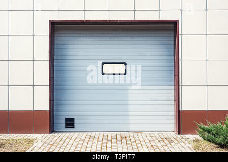 Metal gray gates of the private garage Stock Photo
