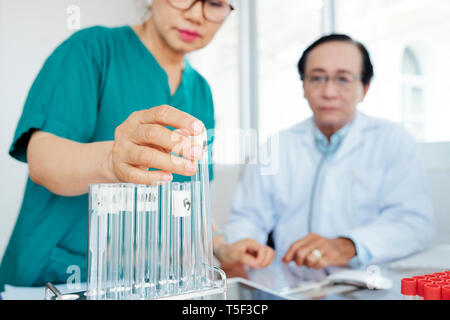 Pharmacologists working on medicine Stock Photo