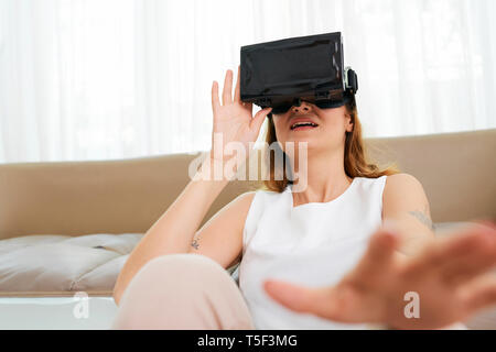 Pretty woman in vr glasses Stock Photo