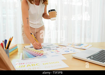 Woman correcting documents Stock Photo