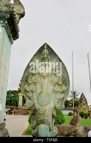 A Naga is a mythical semi divine being, half human and half cobra in the religions of Buddhism, Hinduism and Jainism, seen here at Angkor Wat complex, Stock Photo