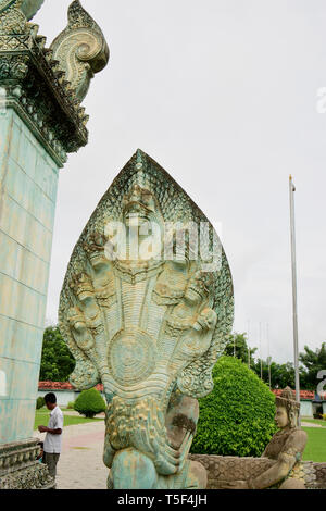 A Naga is a mythical semi divine being, half human and half cobra in the religions of Buddhism, Hinduism and Jainism, seen here at Angkor Wat complex, Stock Photo