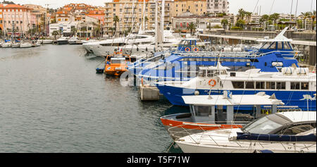 SAN RAPHAEL, FRANCE - APRIL 2019:  Small passenger ferries and sightseeing boats tied up in the harbour in San Raphael Stock Photo