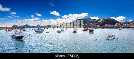 Scenery landscape of fishing port.Cityscape and boats in the sea.Cantabria village.Castrourdiales. Stock Photo