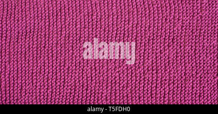 Seamless knitted pattern. Woolen cloth. Pink, violet texture. Stock Photo