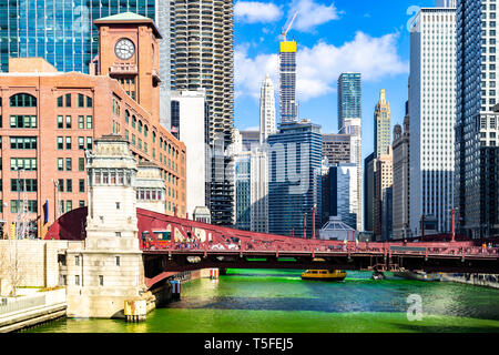 Chicago Skylines building along green dyeing river of Chicago River on St. Patrick's day festival in Chicago Downtown IL USA Stock Photo