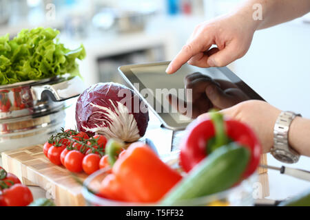 Tablet Showing Vegan Vegetables Salad Recipe Stock Photo
