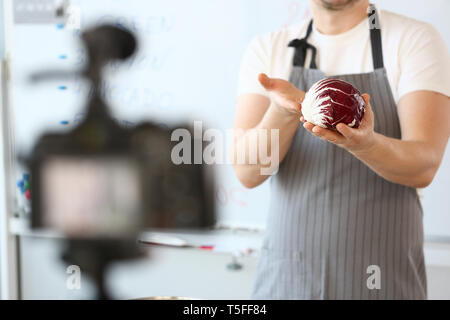 Male Vlogger Hands Holding Purple Organic Cabbage Stock Photo