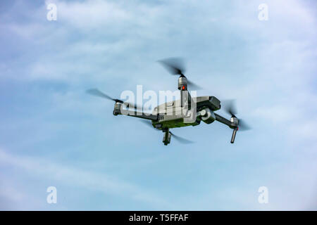 Closeup Looking up at a DJI Mavic 2 PRO personal Drone in flight Stock Photo