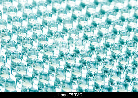 Straight rows of LEDs in the panel close-up macro. Green blue tint Stock Photo