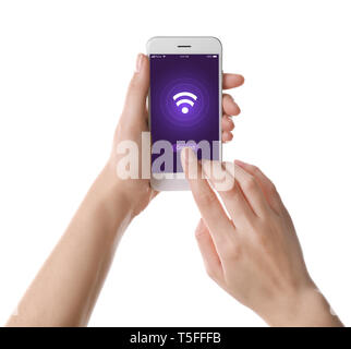 Woman holding mobile phone with Wi-Fi icon on touchscreen against white background Stock Photo