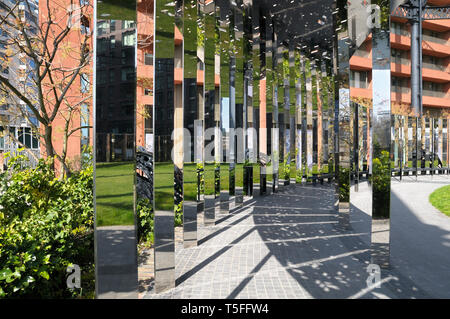 Gasholder Park at King's Cross, London, England, UK.  Circular walkway with a series of vertical mirror strips designed by Bell Phillips Architects. Stock Photo