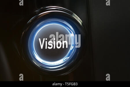 Button Vision pointing the future, blue-lighted on black Stock Photo