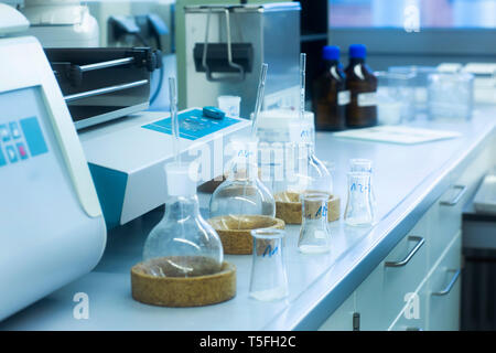 Laboratory glassware on table in lab Stock Photo