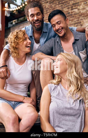 Friends having fun in a backyard in the summer Stock Photo