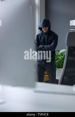 Anonymous teenager hacking PC Stock Photo