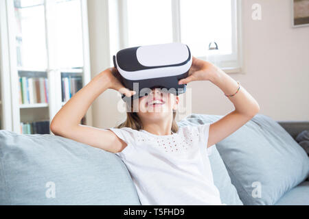 Girl using virtual reality glasses Stock Photo
