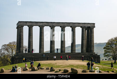 Tourists climbing and standing on National Monument of Scotland, Calton Hill, Edinburgh, Scotland, UK Stock Photo