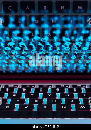 Computer virus infecting a laptop computer with a virus Stock Photo