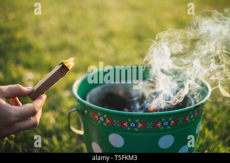 Woman's hand holding lighter Stock Photo