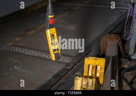 A remote handle for the crane in the workshop. Stock Photo