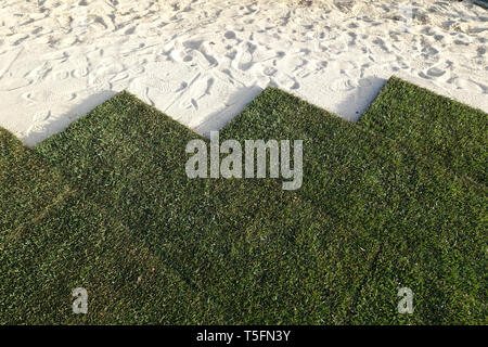 new lawn being created with rolls of turf Stock Photo
