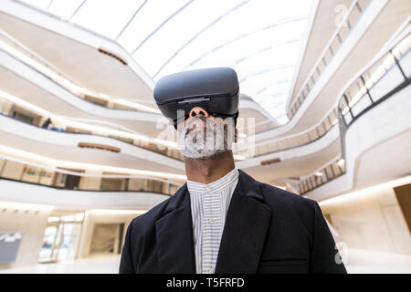 Bearded businessman using Virtual Reality Glasses Stock Photo