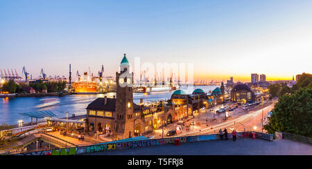 Germany, Hamburg, Port of Hamburg and Landungsbruecken at dusk Stock Photo