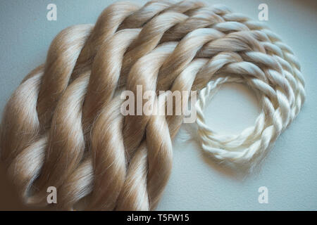 kanekalon artificial material for weaving in African braids, equipment and materials for beauty salons, blond hair, blond hair Stock Photo