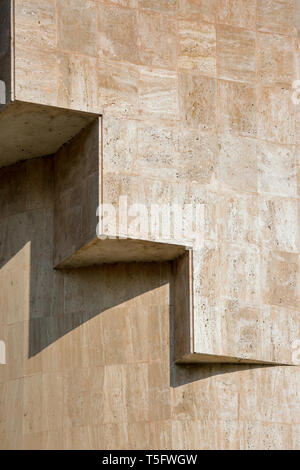 Architecture volume casting shadows on a sandstone facade Stock Photo