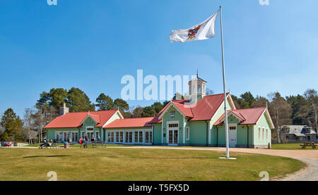 BRAEMAR ABERDEENSHIRE SCOTLAND THE DUKE OF ROTHESAY HIGHLAND GAMES PAVILION PEOPLE OUTSIDE THE RESTAURANT AND FLAG FLYING IN THE BREEZE Stock Photo