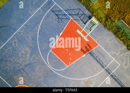 Aerial view, Top View, Bird eye view of school college with Basketball courts. basketball field in morning right. Stock Photo