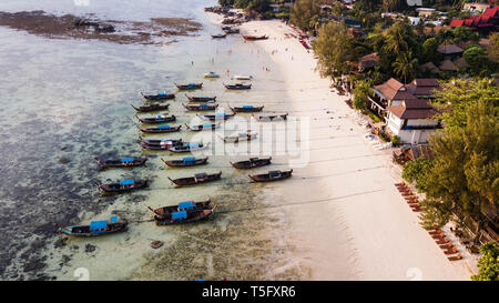Aerial view over group of long tail boats in sunrise beach. Koh Lipe island, Satun, Thailand