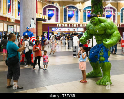 Bangkok, Thailand - Apr 24, 2019: Unidentified Man taking a photo of his child with the Hulk model during Avengers 4 Endgame showing in the movies