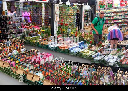 AMSTERDAM, NETHERLANDS - JULY 8, 2017: People visit the flower market (Bloemenmarkt) in Amsterdam, Netherlands. Bloemenmarkt is the famous flower mark Stock Photo