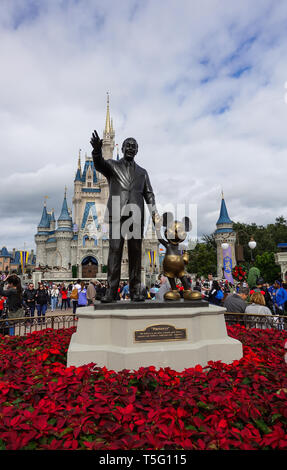 Orlando, FL/USA - 02/10/18: Vertical View of Walt Disney and Mickey Mouse Partners statue in front of Cinderellas Castle at Disney World. Stock Photo