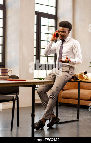 Handsome good looking man making a call Stock Photo