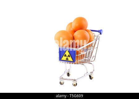 Radioactive contaminated eggs in a shopping cart - isolated Stock Photo