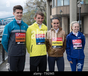 London, UK. 24th Apr, 2019. The London Marathon British Athletes Photocall takes place outside the Tower Hotel with Tower Bridge in the background ahead of the Marathon on Sunday. Taking part are: Callum Hawkins, Dewi Griffiths, Charlotte Purdue and Lily Partridge. Credit: Keith Larby/Alamy Live News Stock Photo
