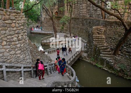 Chandigarh, Chandigarh, India. 24th Apr, 2019. Visitors are seen walking around the asia's largest Rock Garden in Chandigarh.Rock Garden in Chandigarh is a sculptural art garden in India. The 40-acres Rock Garden is built of industrial waste and thrown-away items. Credit: Saqib Majeed/SOPA Images/ZUMA Wire/Alamy Live News Stock Photo