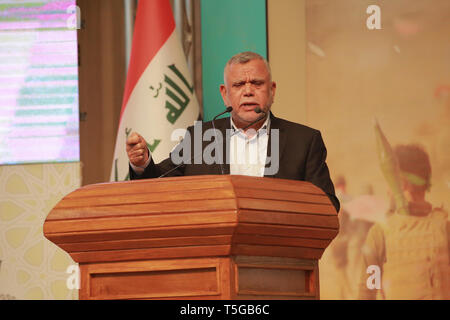 Baghdad, Iraq. 24th Apr, 2019. Hadi Al-Amiri, former Iraqi minister of transportation and Leader of the Fatah Alliance, speaks during a conference organized by the predominantly Shia Muslim Popular Mobilization Forces (PMF) to honour Iranian fighters who died fighting the so-called Islamic State (IS) terror group. Credit: Ameer Al Mohammedaw/dpa/Alamy Live News Stock Photo