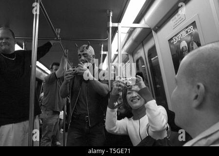 Washington, DC, USA. 31st Oct, 2003. People take photos of other people wearing costumes for Halloween on the Metro in Washington, DC, October 31, 2003. Credit: Bill Putnam/ZUMA Wire/Alamy Live News Stock Photo