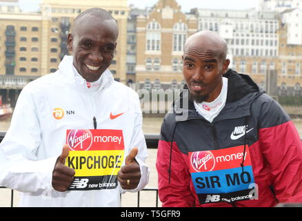 Eliud Kipchoge and Sir Mo Farah at the Elite Runners Photocall for the London Marathon 2019 outside the Tower Hotel Race HQ Stock Photo