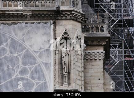 Paris, France. 24th Apr, 2019. Temporary tarpaulins are seen to protect Notre-Dame Cathedral from rain damage in Paris, capital of France, April 24, 2019. Credit: Gao Jing/Xinhua/Alamy Live News Stock Photo